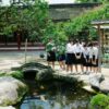 women looking into pond